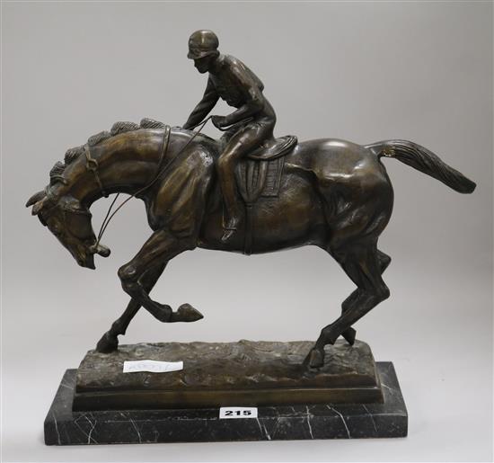 A bronze model of a jockey and horse height 34cm width 30cm